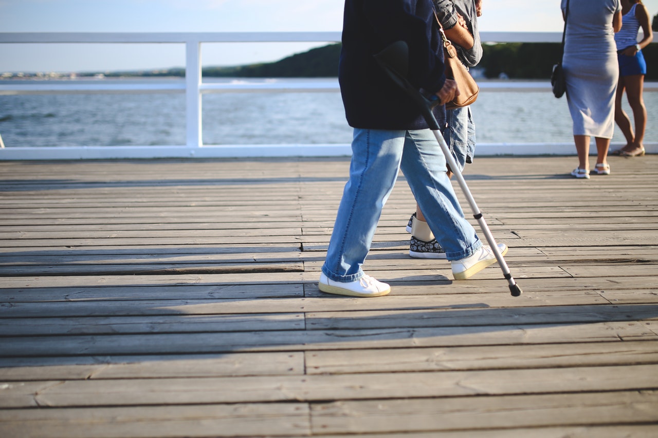 woman walking jeans pier