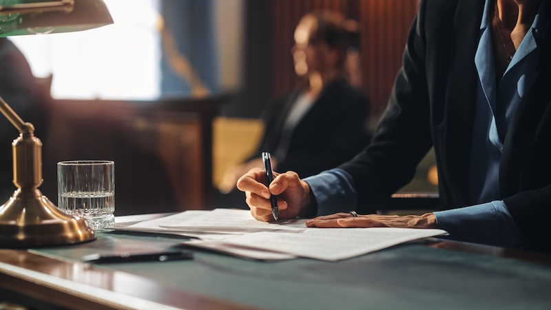 Attorney writing down information in the office