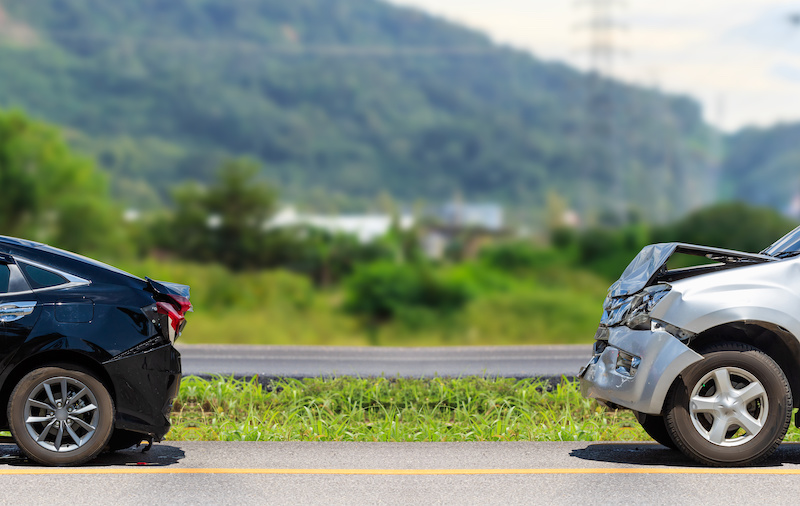 Car accident involving two cars on the road.