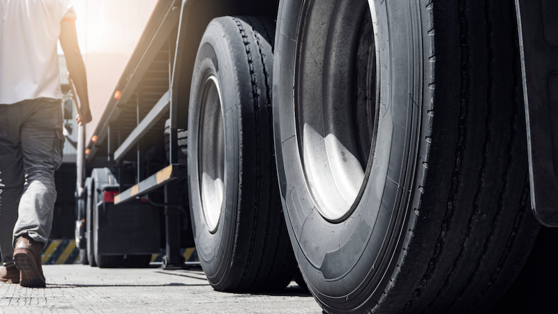 Man walking next to truck