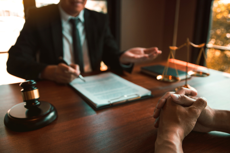 Lawyer and client sitting in lawyers office