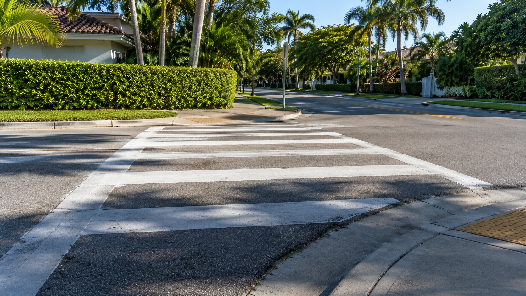 Empty painted crosswalk at a South Florida school zone intersection